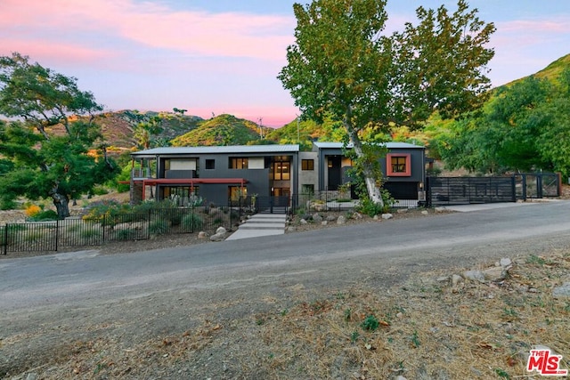 modern home featuring a mountain view