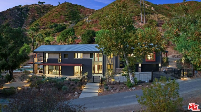 view of front of home with a mountain view