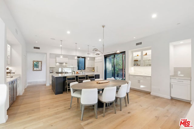 dining area with light hardwood / wood-style floors