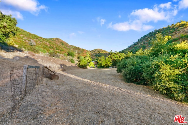 exterior space with a mountain view and a rural view