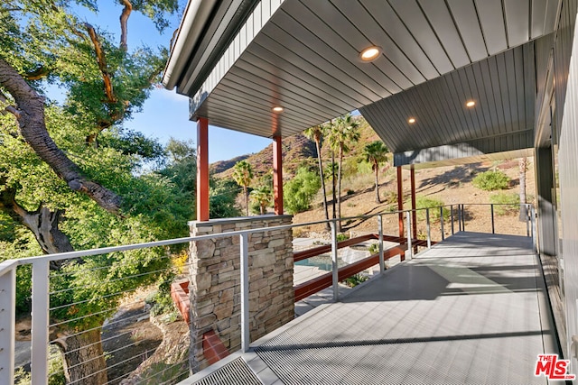 view of patio / terrace featuring a balcony and a mountain view