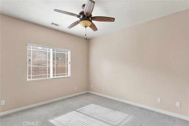 carpeted empty room with ceiling fan