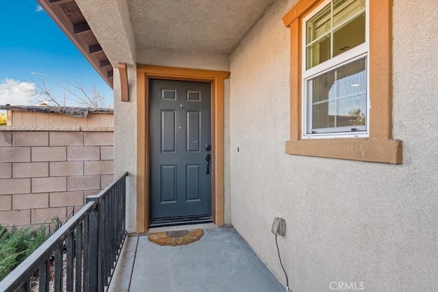 property entrance with a balcony