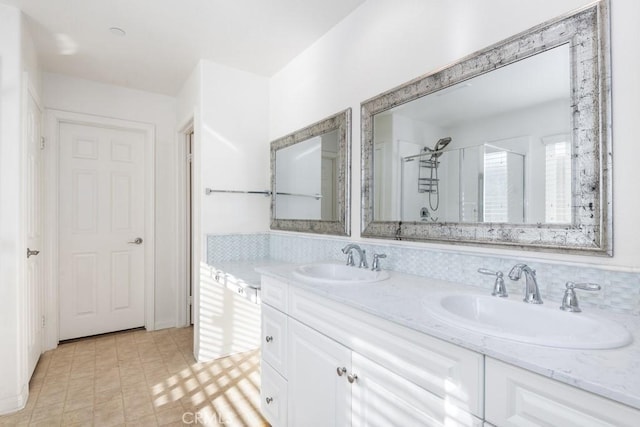 bathroom featuring vanity and a shower with shower door