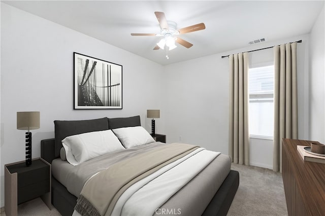 carpeted bedroom with ceiling fan