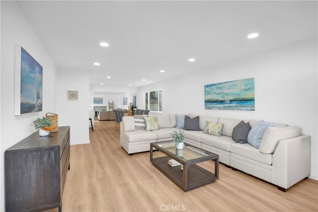 living room featuring recessed lighting and light wood finished floors