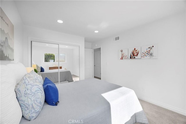 carpeted bedroom featuring a closet