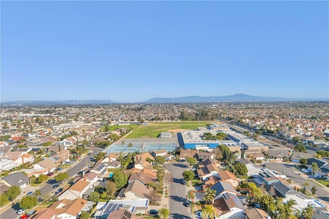 birds eye view of property featuring a mountain view