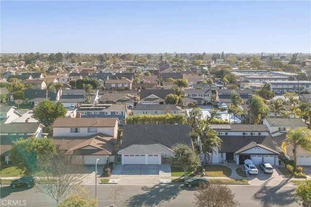 birds eye view of property with a residential view