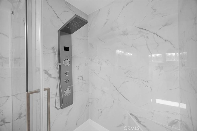 bathroom with a tile shower