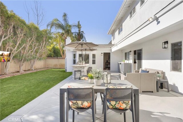 view of patio with fence and outdoor lounge area