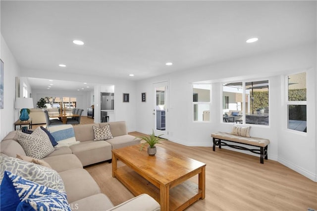 living room with light hardwood / wood-style flooring