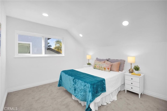 carpeted bedroom featuring vaulted ceiling