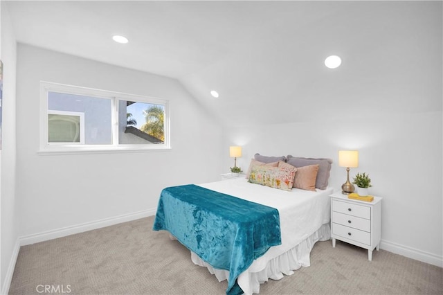 bedroom with vaulted ceiling, recessed lighting, baseboards, and light colored carpet