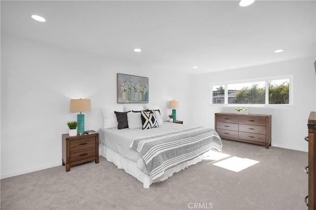 bedroom featuring light carpet