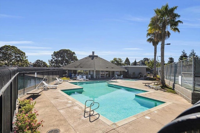 view of swimming pool with a patio area