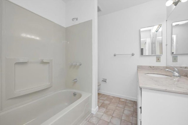 full bathroom featuring vanity, bathtub / shower combination, and toilet