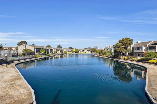 view of swimming pool with a water view