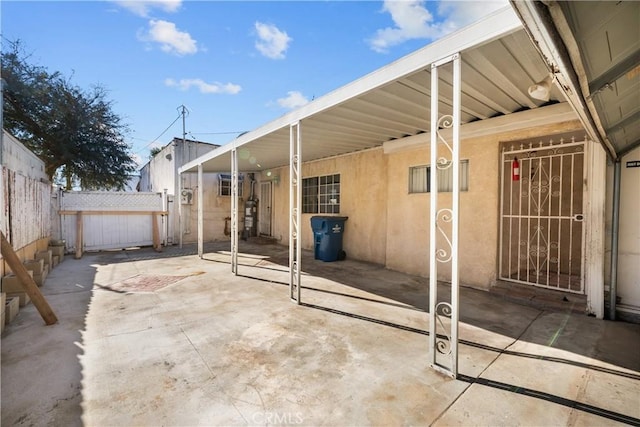 view of patio with a garage and an outdoor structure