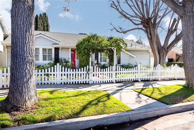 ranch-style home with a front lawn