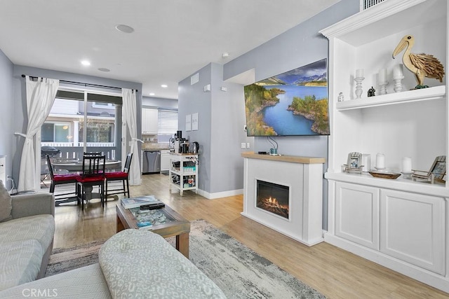 living room with light hardwood / wood-style flooring