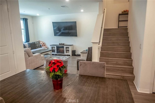 living room with dark hardwood / wood-style floors