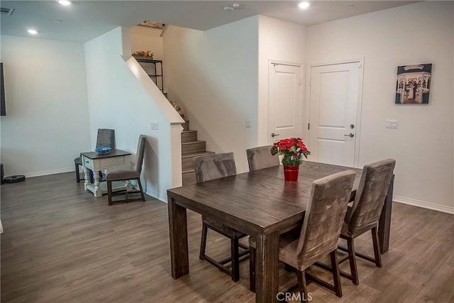 dining space featuring dark hardwood / wood-style floors