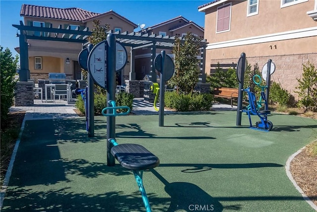 view of property's community featuring area for grilling and a pergola