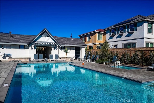 view of swimming pool with a patio area