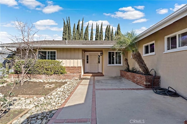 property entrance with a patio area