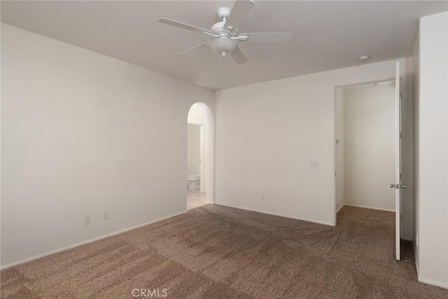 unfurnished room with ceiling fan and carpet flooring