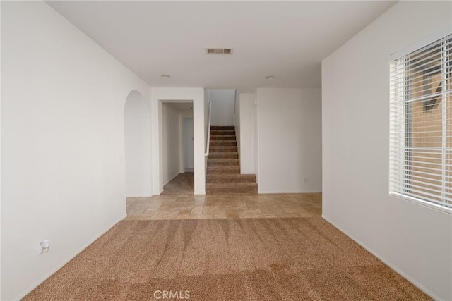 interior space featuring light colored carpet