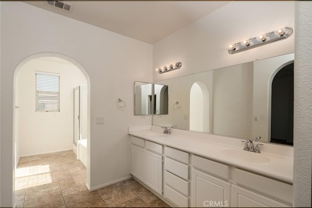 bathroom with independent shower and bath and vanity