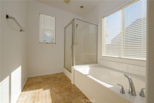 bathroom with tile patterned floors and shower with separate bathtub