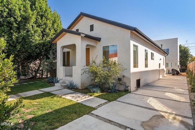 exterior space with a front yard