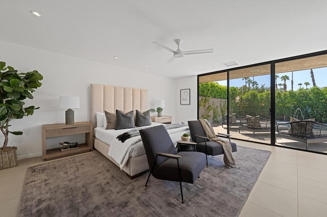 bedroom featuring tile patterned flooring, ceiling fan, access to exterior, and a wall of windows