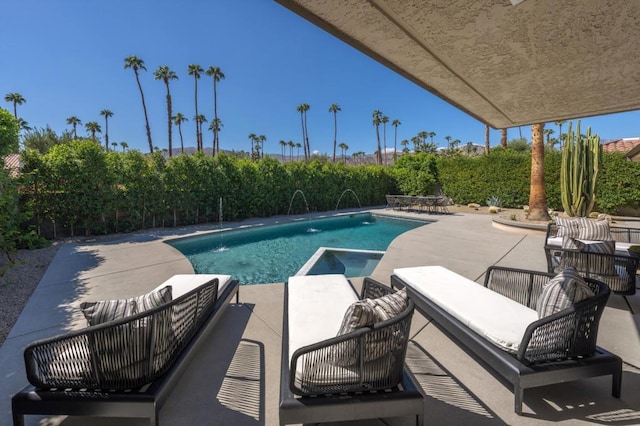 view of pool with a patio and pool water feature