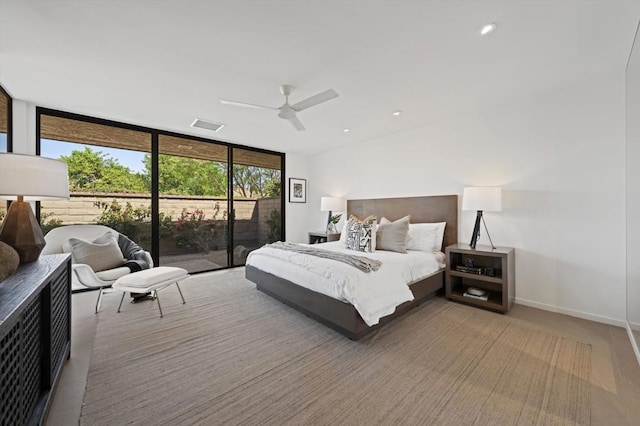 bedroom with ceiling fan, floor to ceiling windows, and access to outside