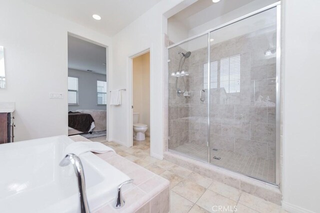 full bathroom featuring vanity, toilet, independent shower and bath, and tile patterned flooring