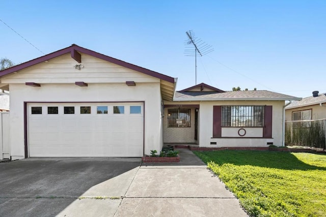 view of front of property with a garage and a front lawn