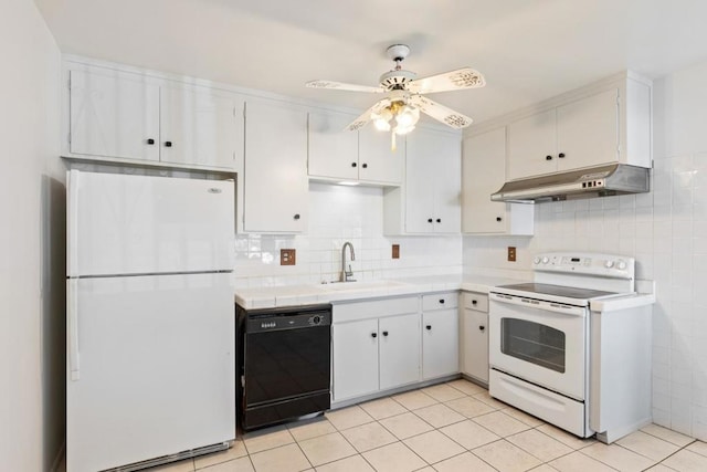 kitchen with sink, white appliances, light tile patterned floors, white cabinetry, and decorative backsplash