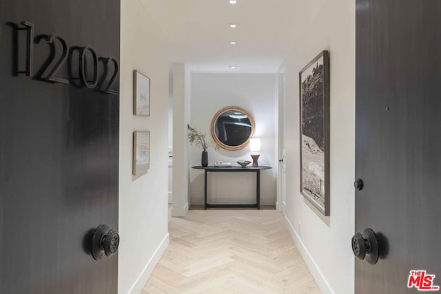 hallway with light parquet floors