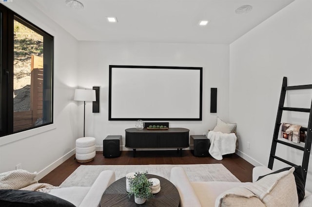 home theater room with dark hardwood / wood-style floors