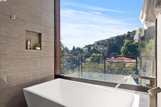 bathroom featuring a tub to relax in