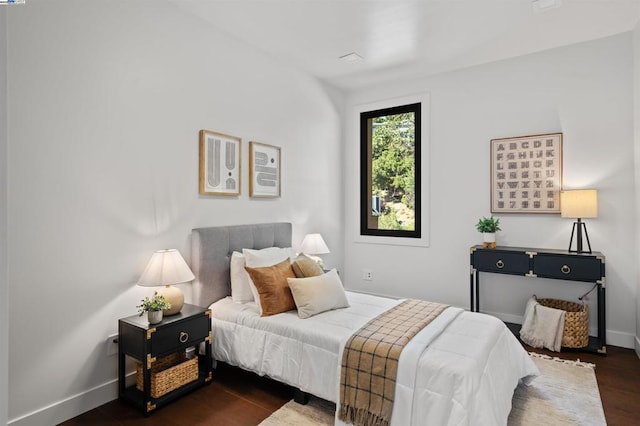 bedroom featuring dark wood-type flooring