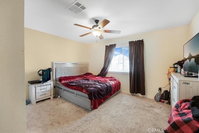 bedroom featuring a ceiling fan, carpet, and visible vents