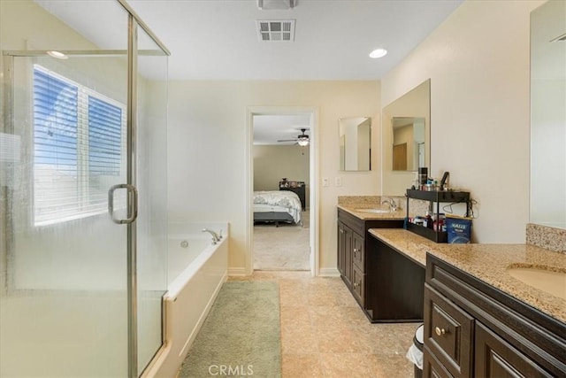 ensuite bathroom featuring a sink, visible vents, ensuite bathroom, and a shower stall