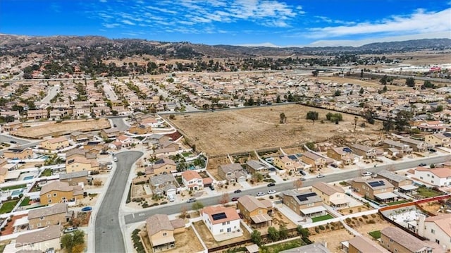 26605 Rose Bud Ln, Moreno Valley, CA 92555 - aerial view of property's location with a mountain backdrop and nearby suburban area