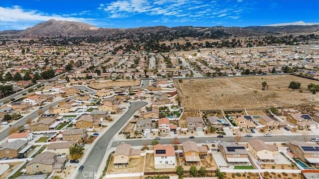26605 Rose Bud Ln, Moreno Valley, CA 92555 - aerial overview of property's location featuring a mountain backdrop and nearby suburban area