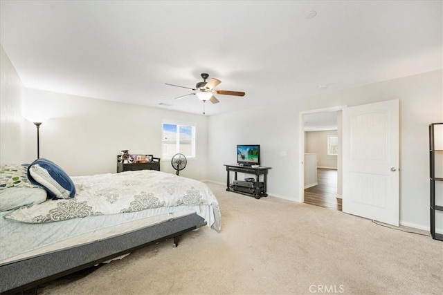 bedroom featuring baseboards, carpet, and ceiling fan